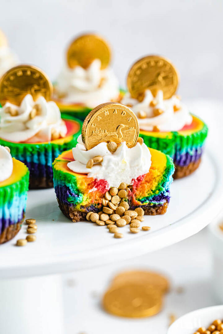 close up of cheesecake with gold sprinkles spilling out