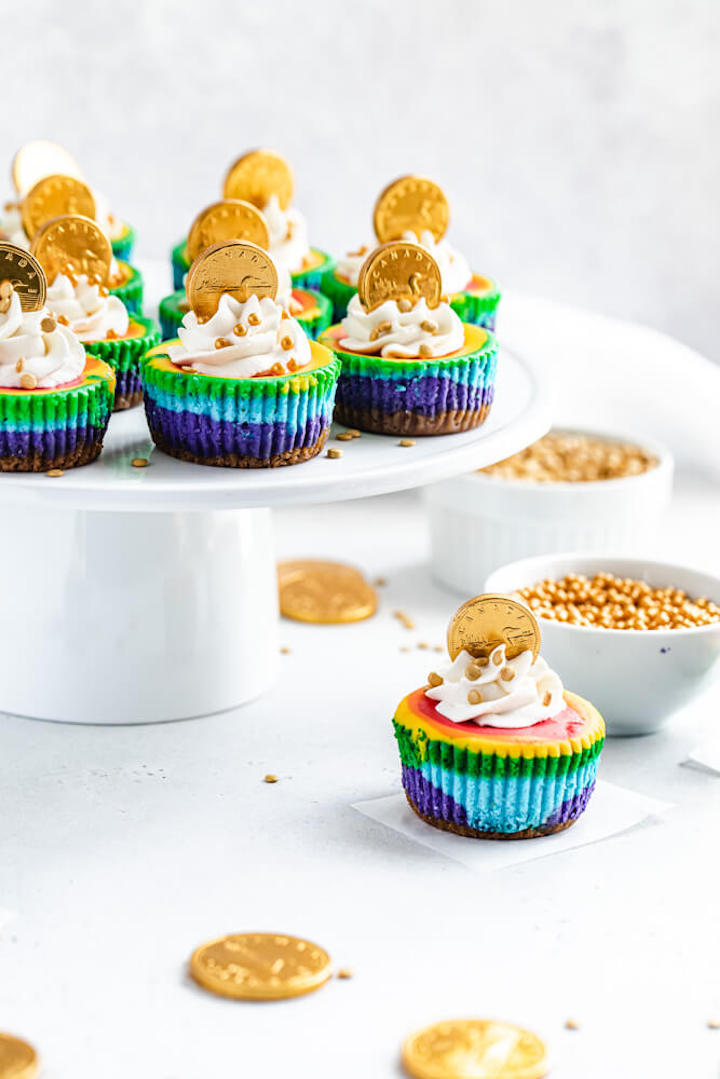 cheesecake cupcakes on a white cake stand