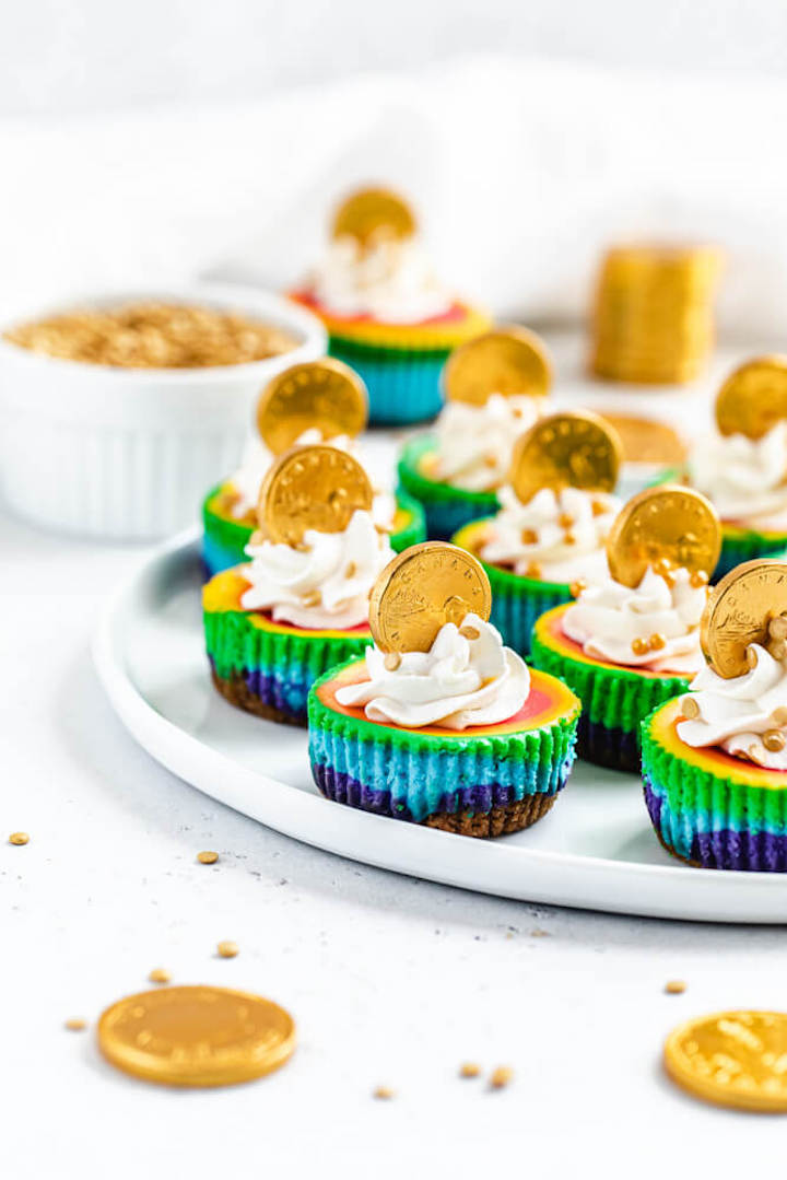 colourful mini cheesecakes on a white plate