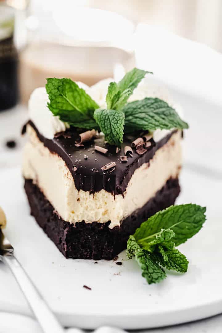 close up front view of cheesecake on a white plate