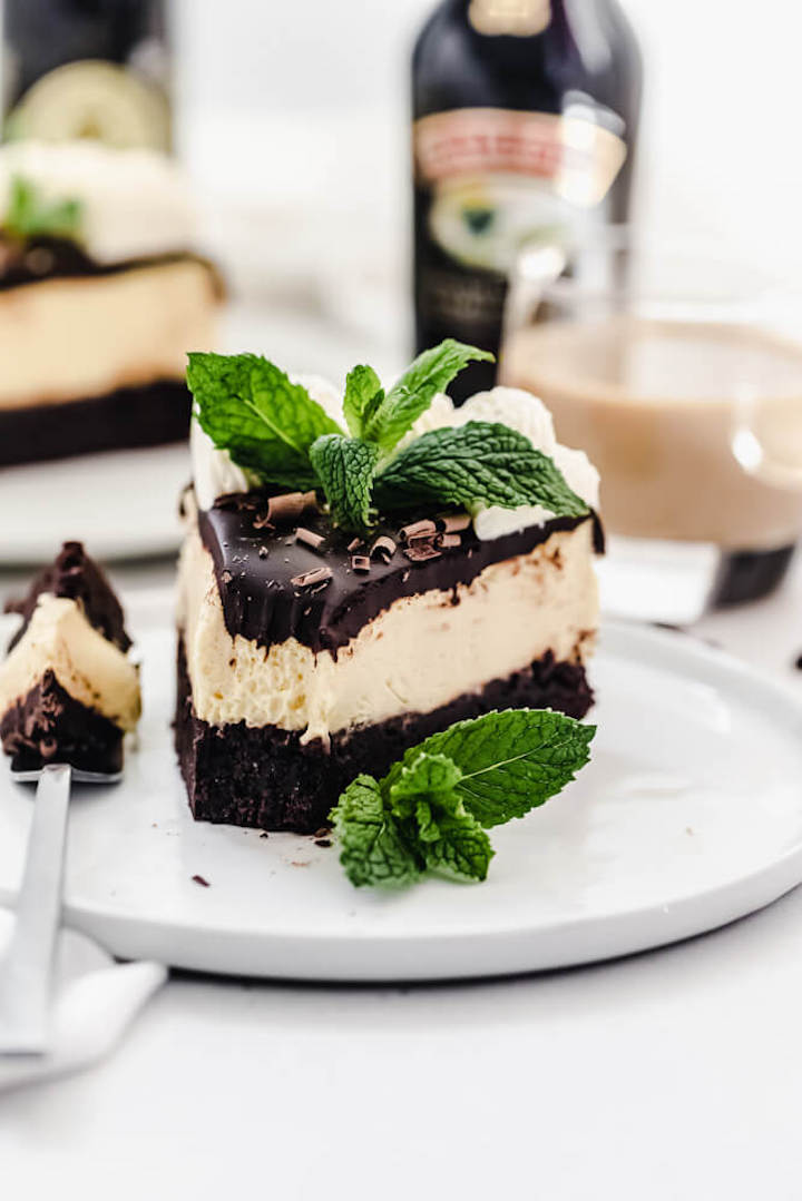 close up of half eaten cheesecake on a plate 