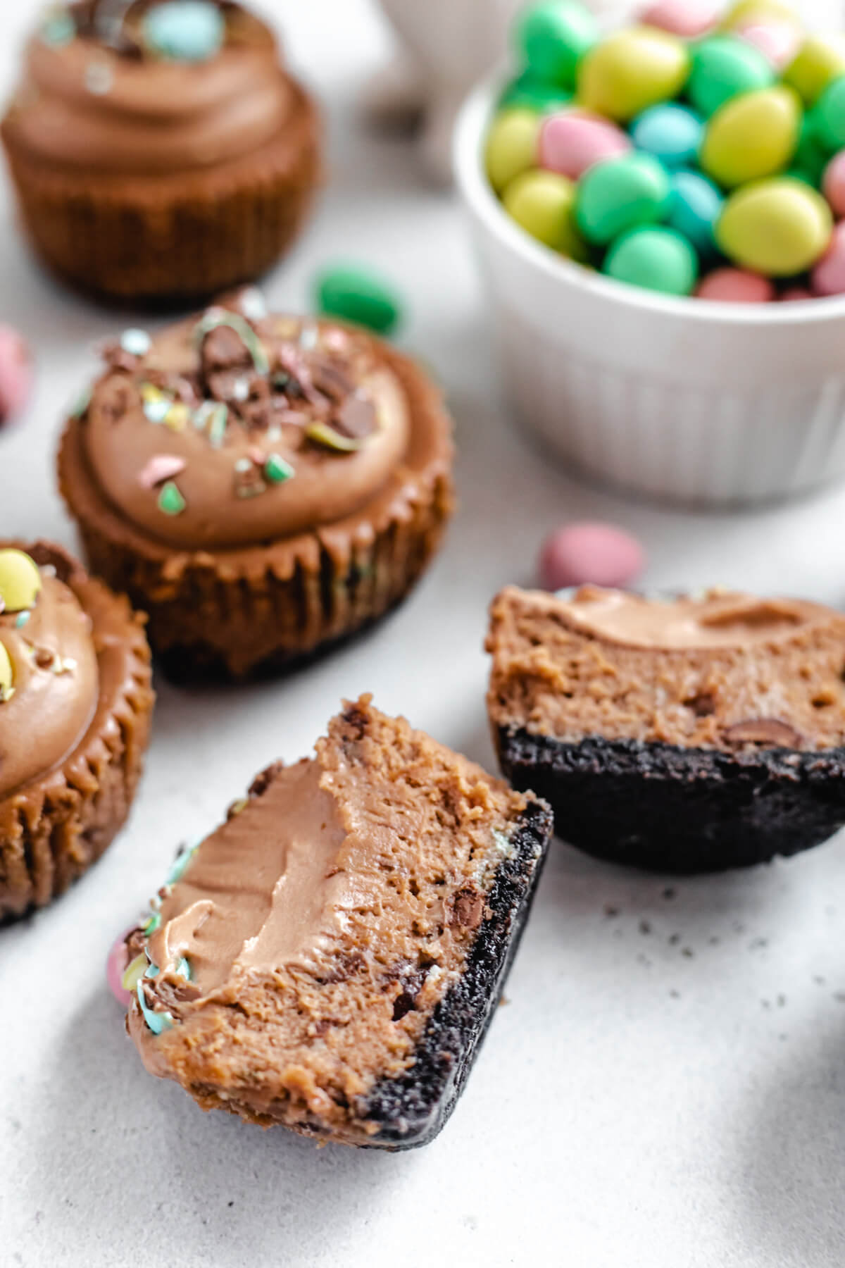 close up of halved mini chocolate cheesecake