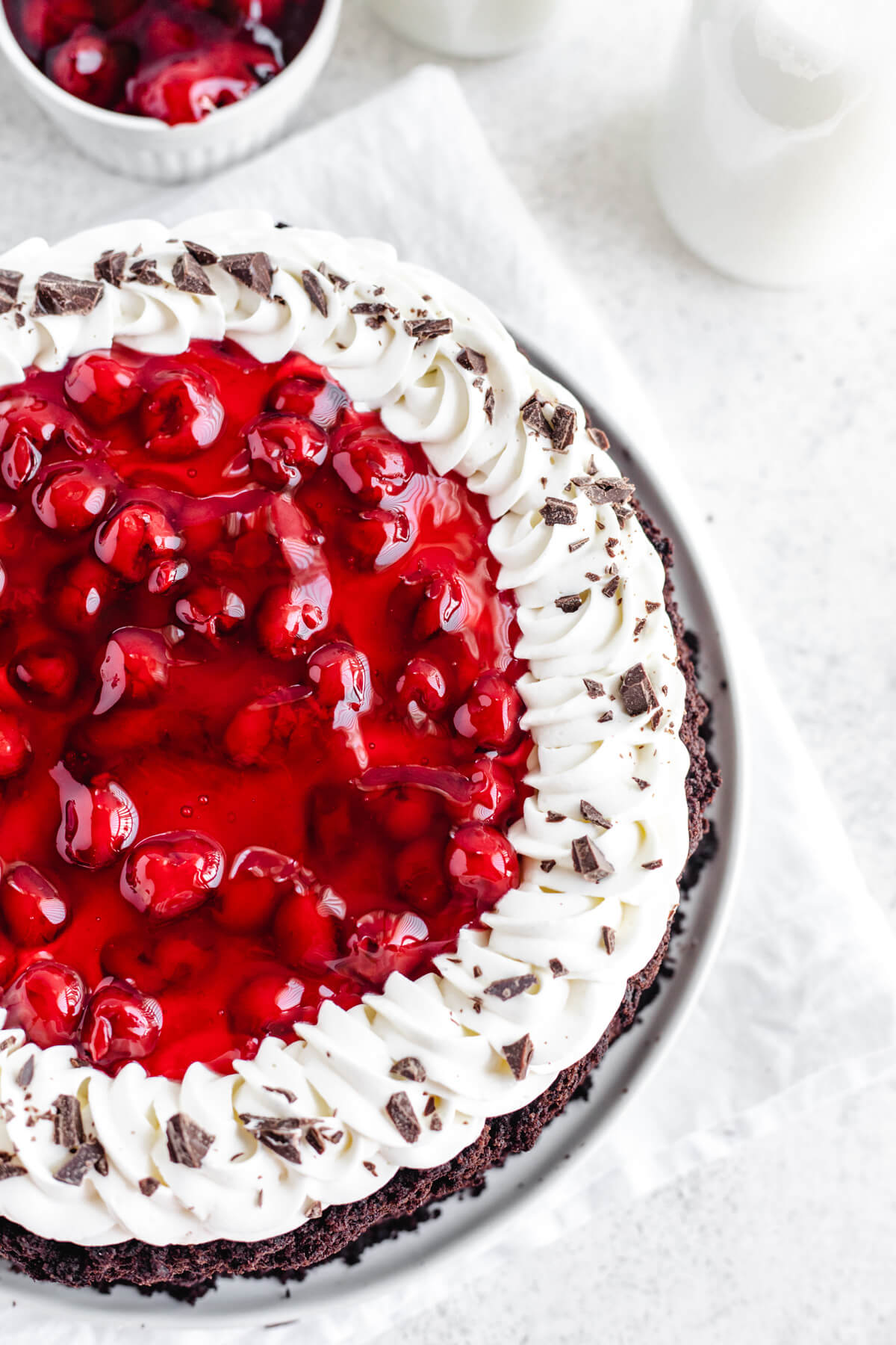 close up top view of cherry topped cheesecake