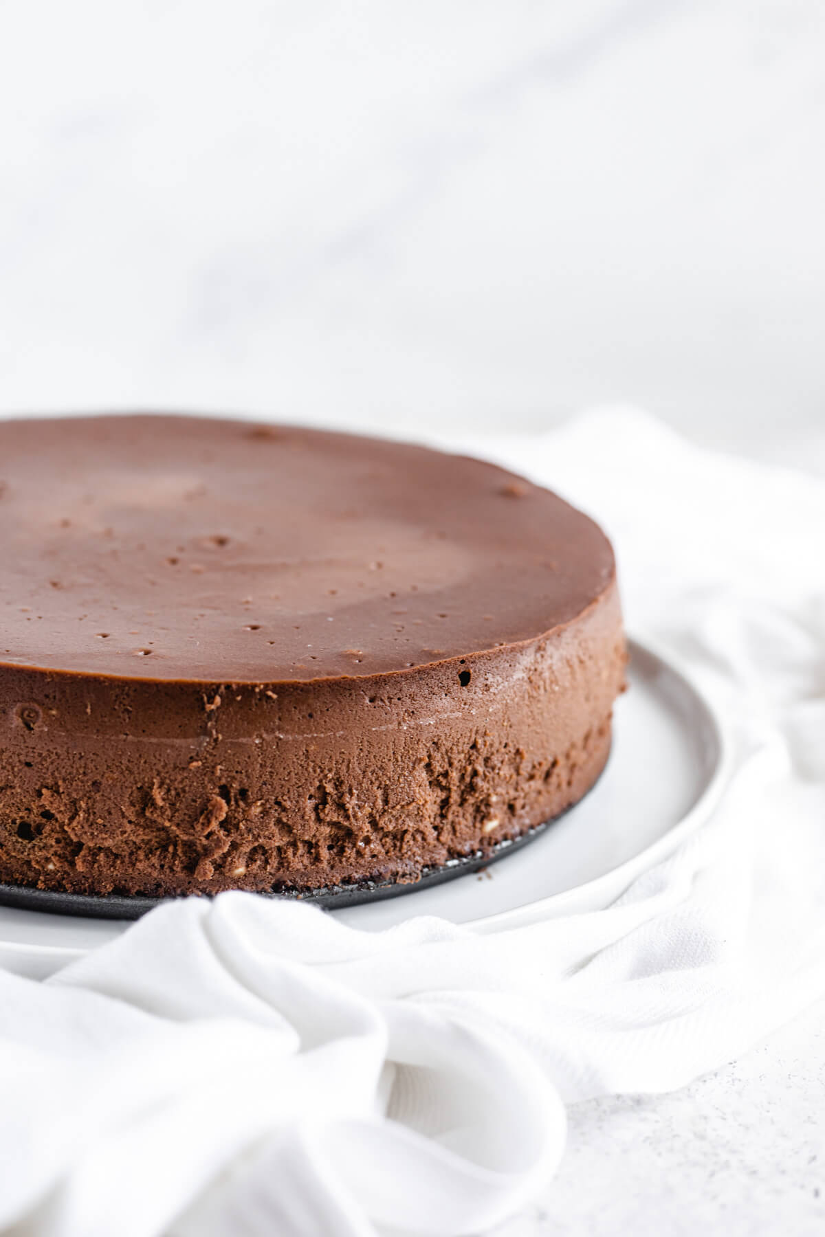 plain cheesecake on a large white plate