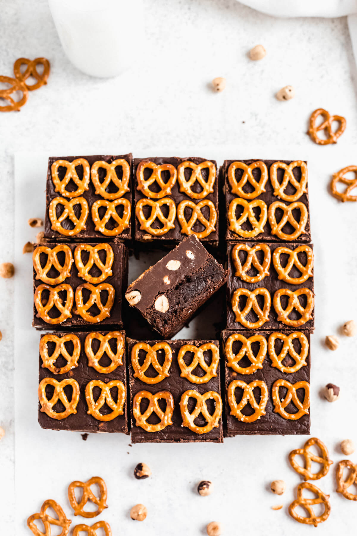 brownies lined up in a square with middle brownie facing up on its side