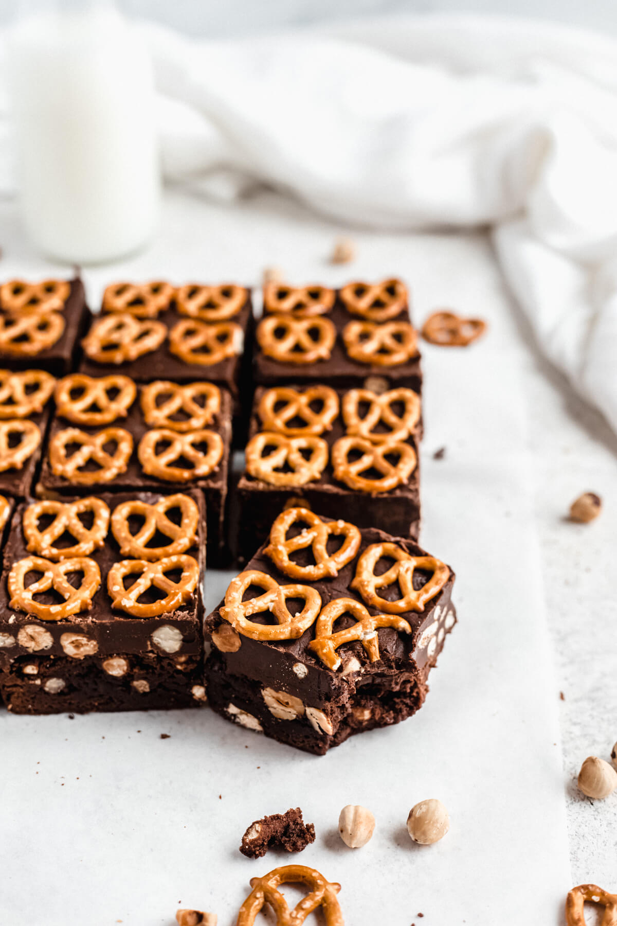 brownies lined up in rows with bite taken out of the one in front