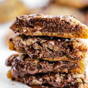 halved chocolate chunk cookies stacked on top of each other