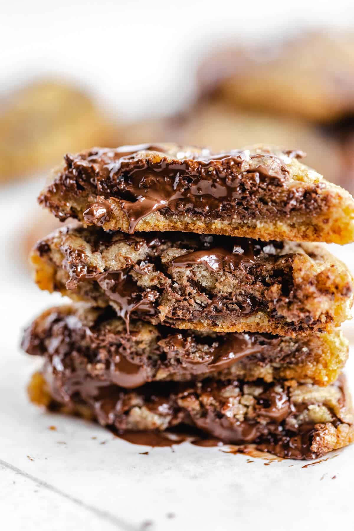 halved chocolate chunk cookies stacked on top of each other