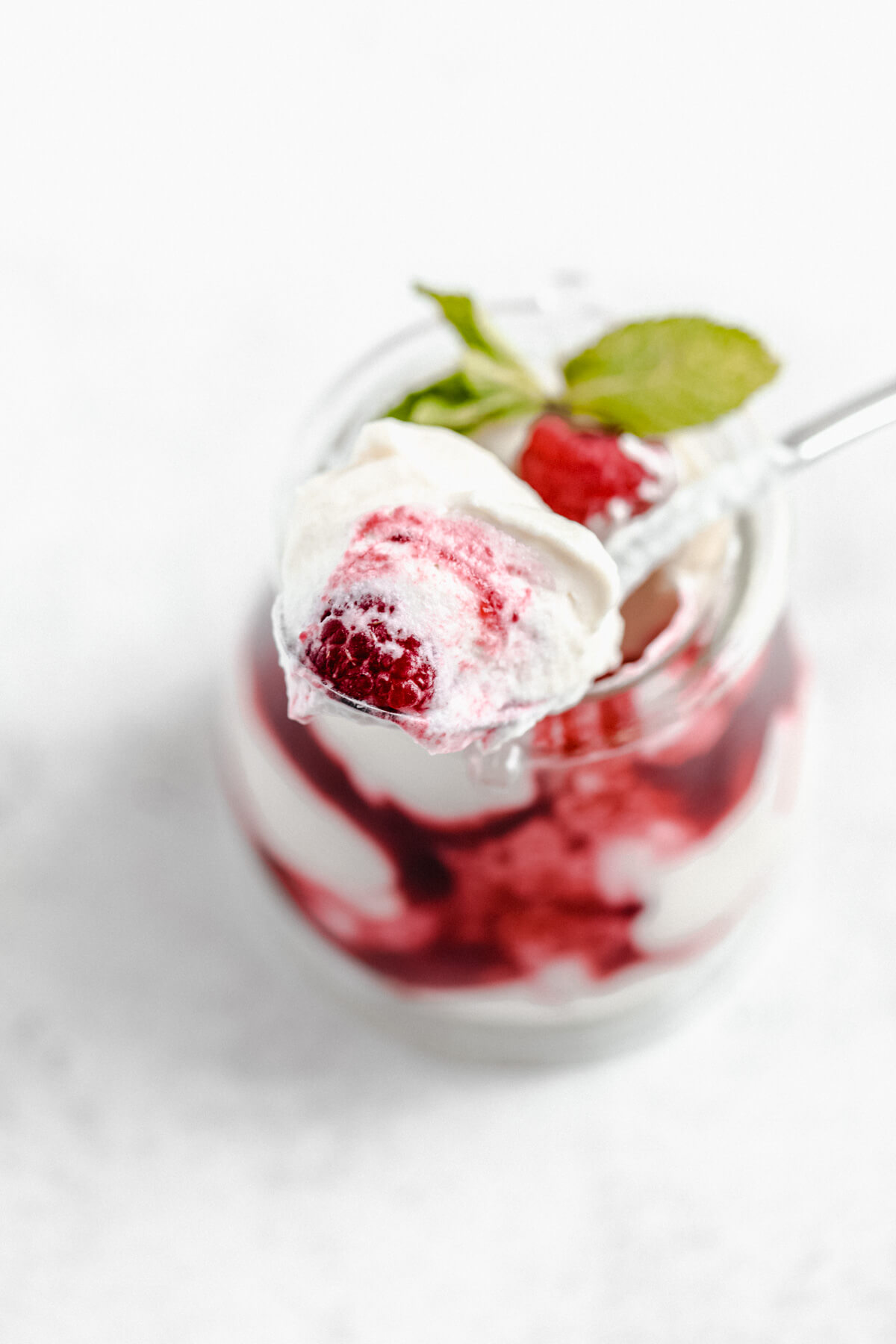 spoonful of mousse with a raspberry inside