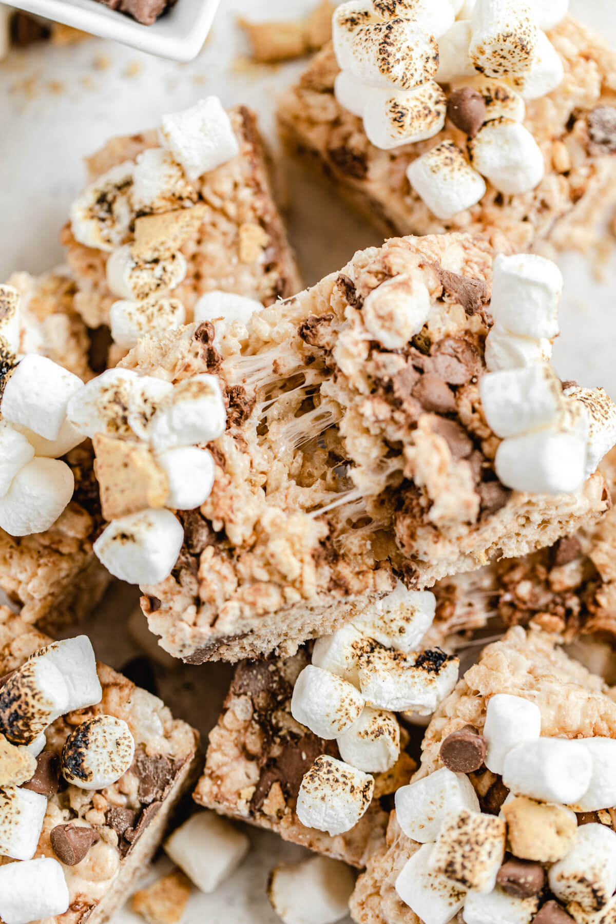 gooey marshmallow between Rice Krispie bar broken in half