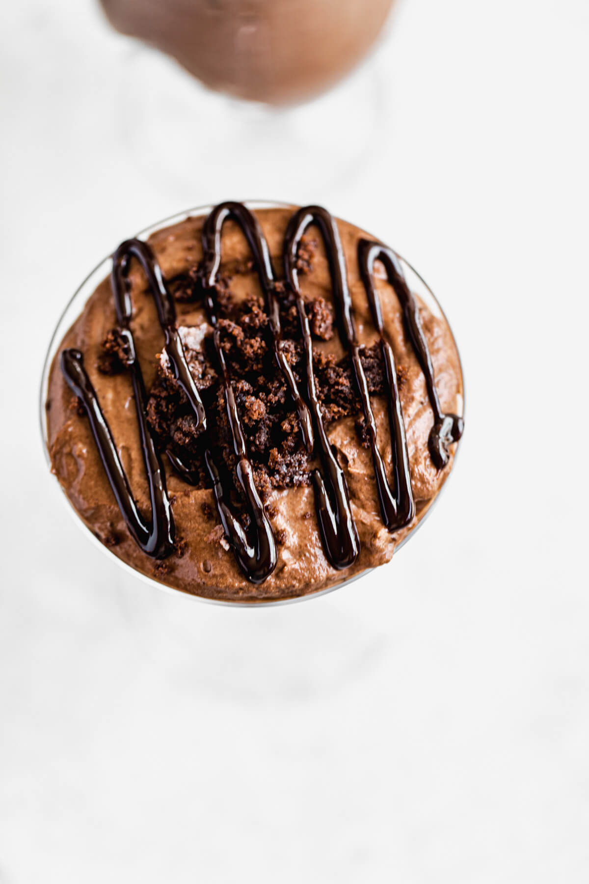 top view of parfaits with mousse, crumbled brownies and a drizzle of ganache on top