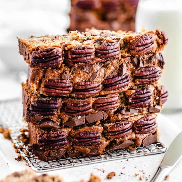 stack of four slices of banana bread, with pecans on the front