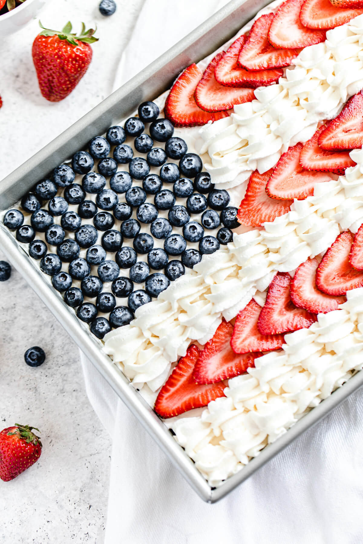 half of cheesecake decorated to look like the American flag