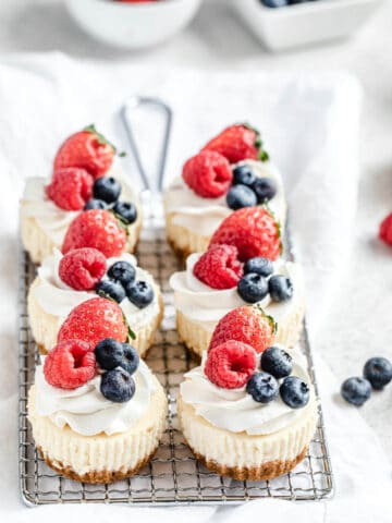 six cheesecake cupcakes on a safety grater