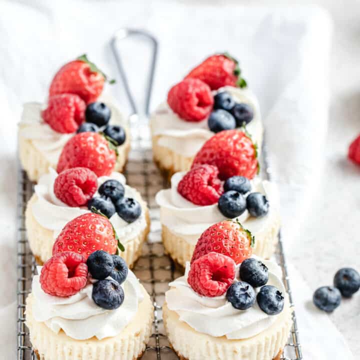 six cheesecake cupcakes on a safety grater