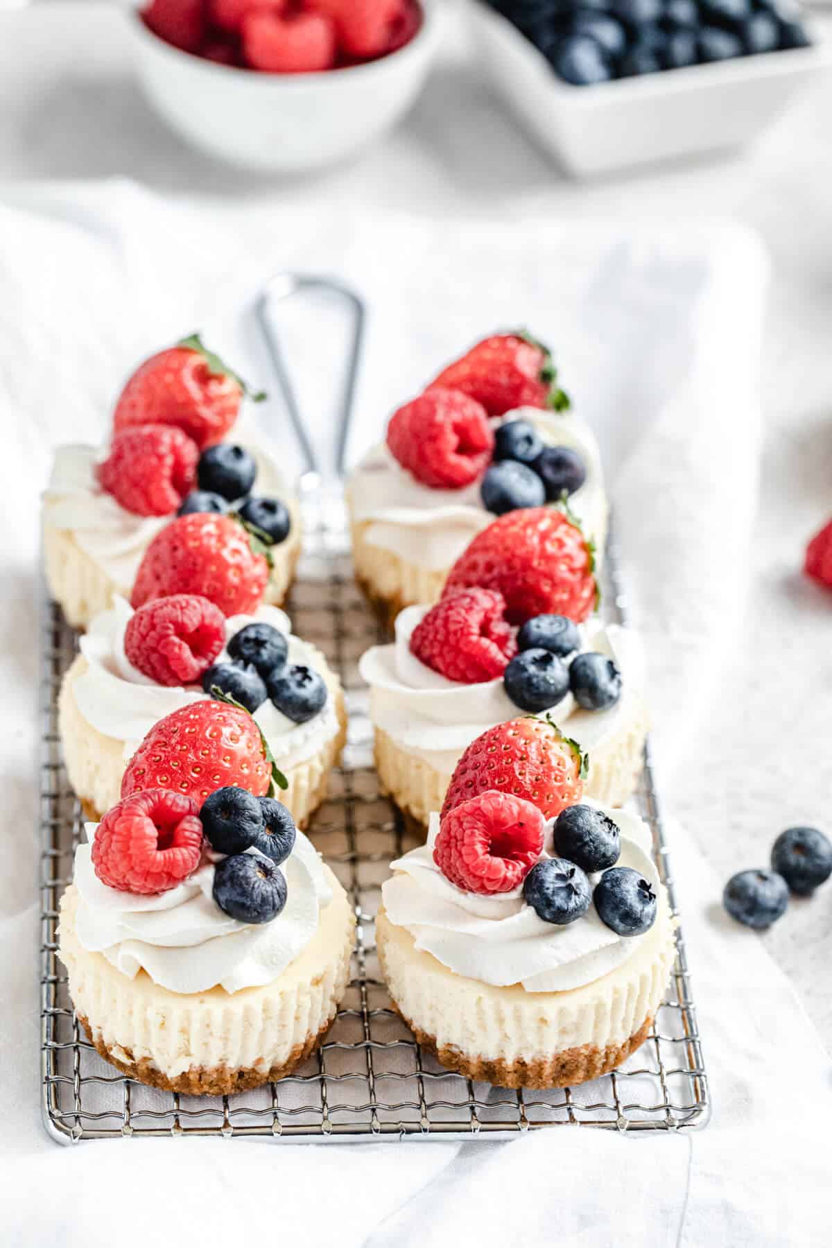 six cheesecake cupcakes on a safety grater