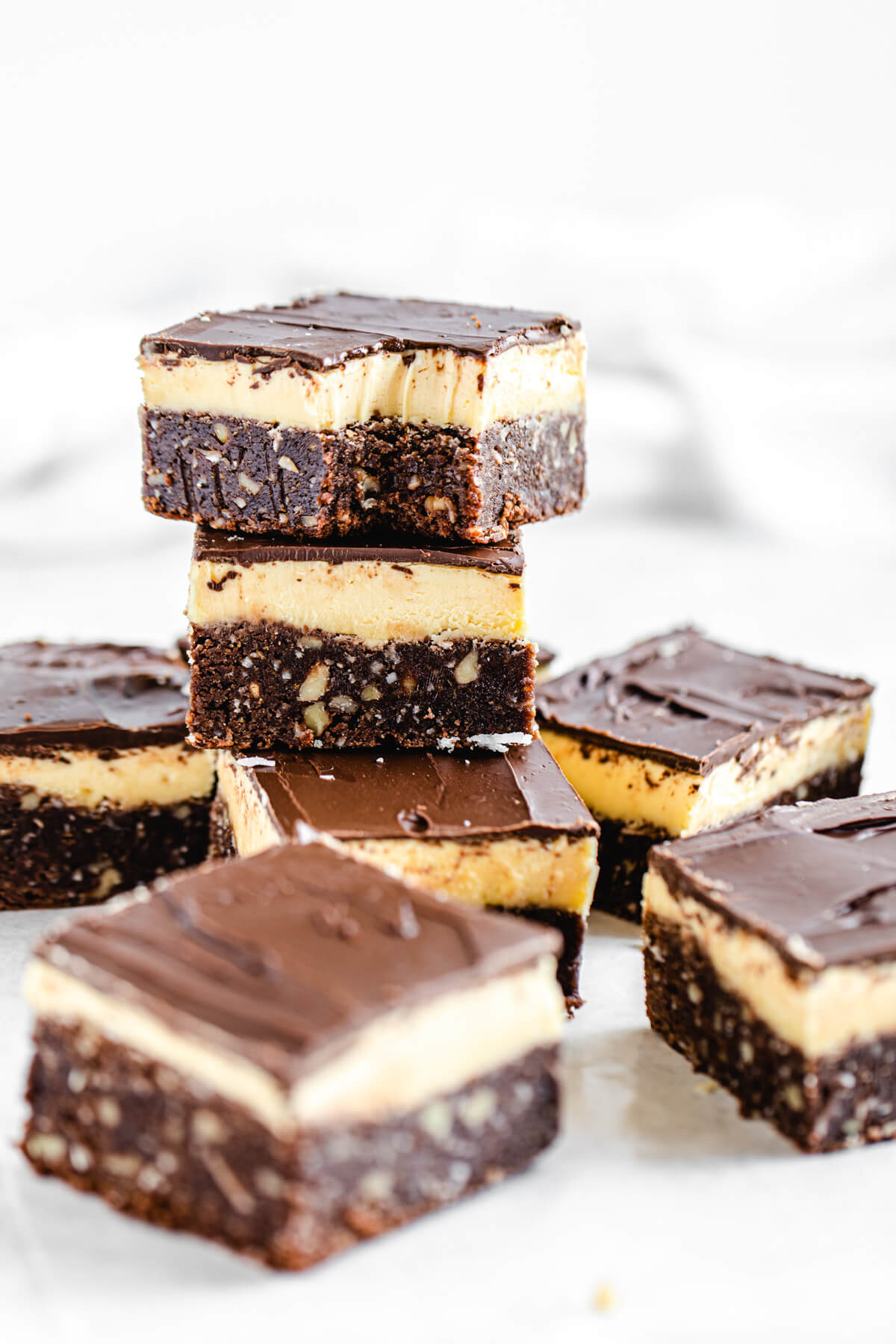 stack of brownies with a half eaten brownie on top