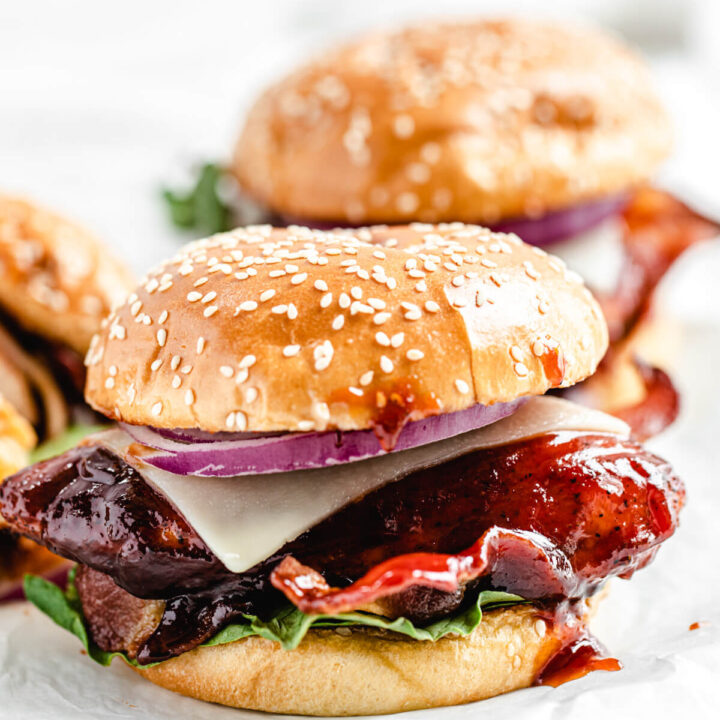 close up of chicken sandwich on a white platter