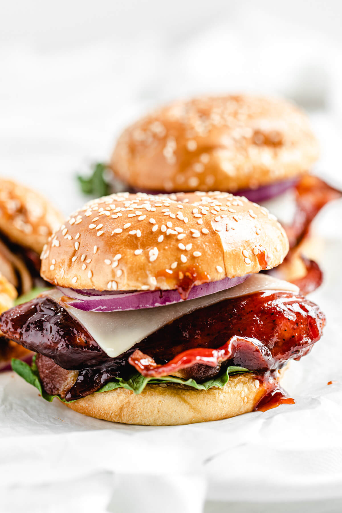 close up of chicken sandwich on a white platter