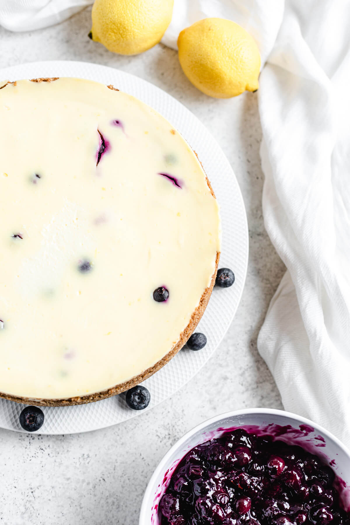 plain whole cheesecake on a white plate