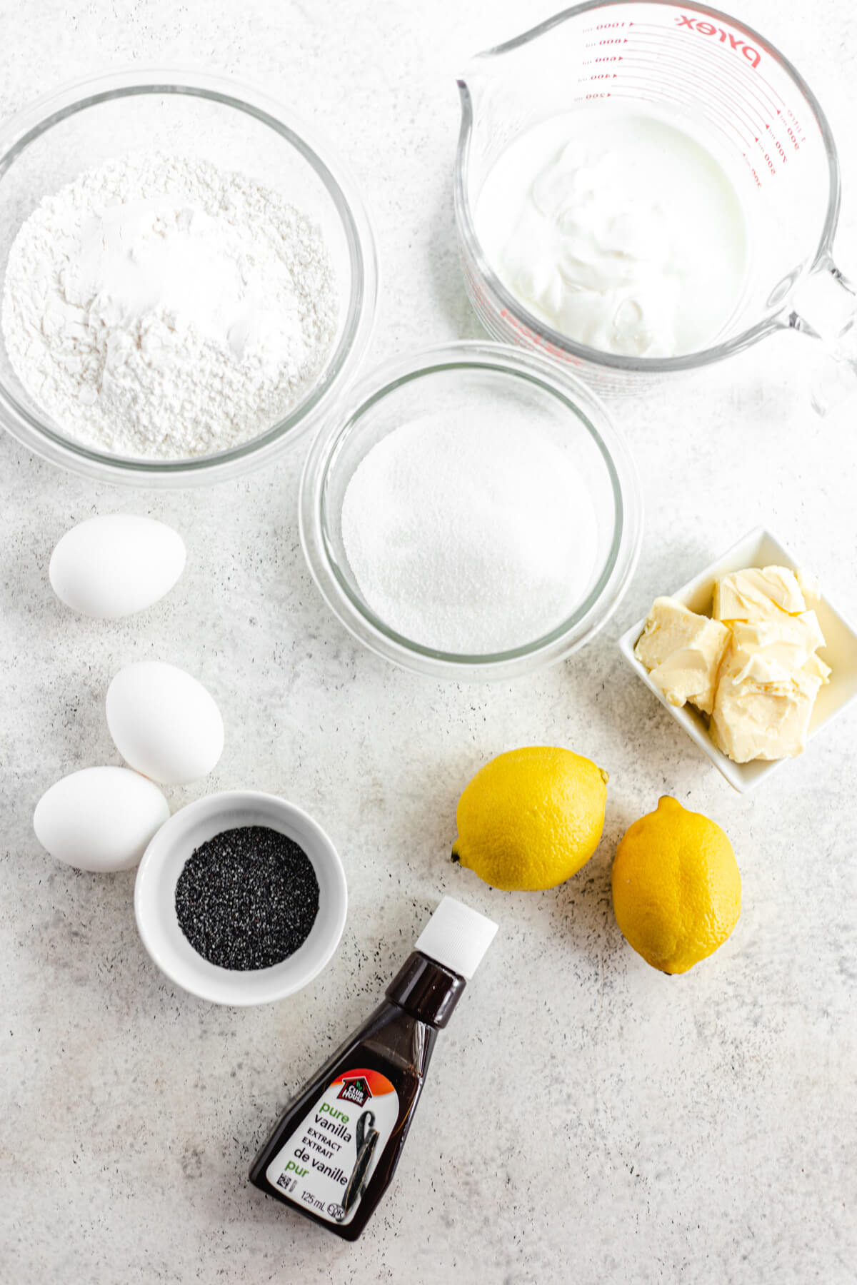 3 eggs, 2 lemons, butter, vanilla, sugar, flour, poppy seeds and buttermilk ingredients