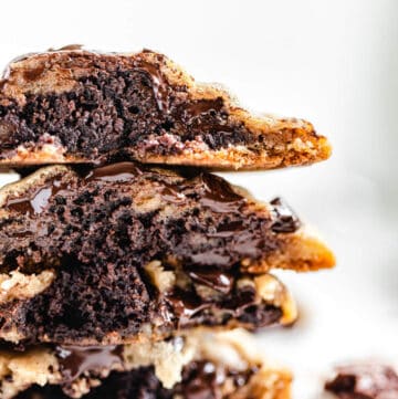 stack of halved brownie stuffed chocolate chip cookies