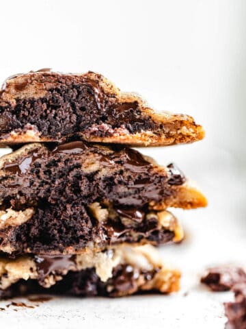 stack of halved brownie stuffed chocolate chip cookies