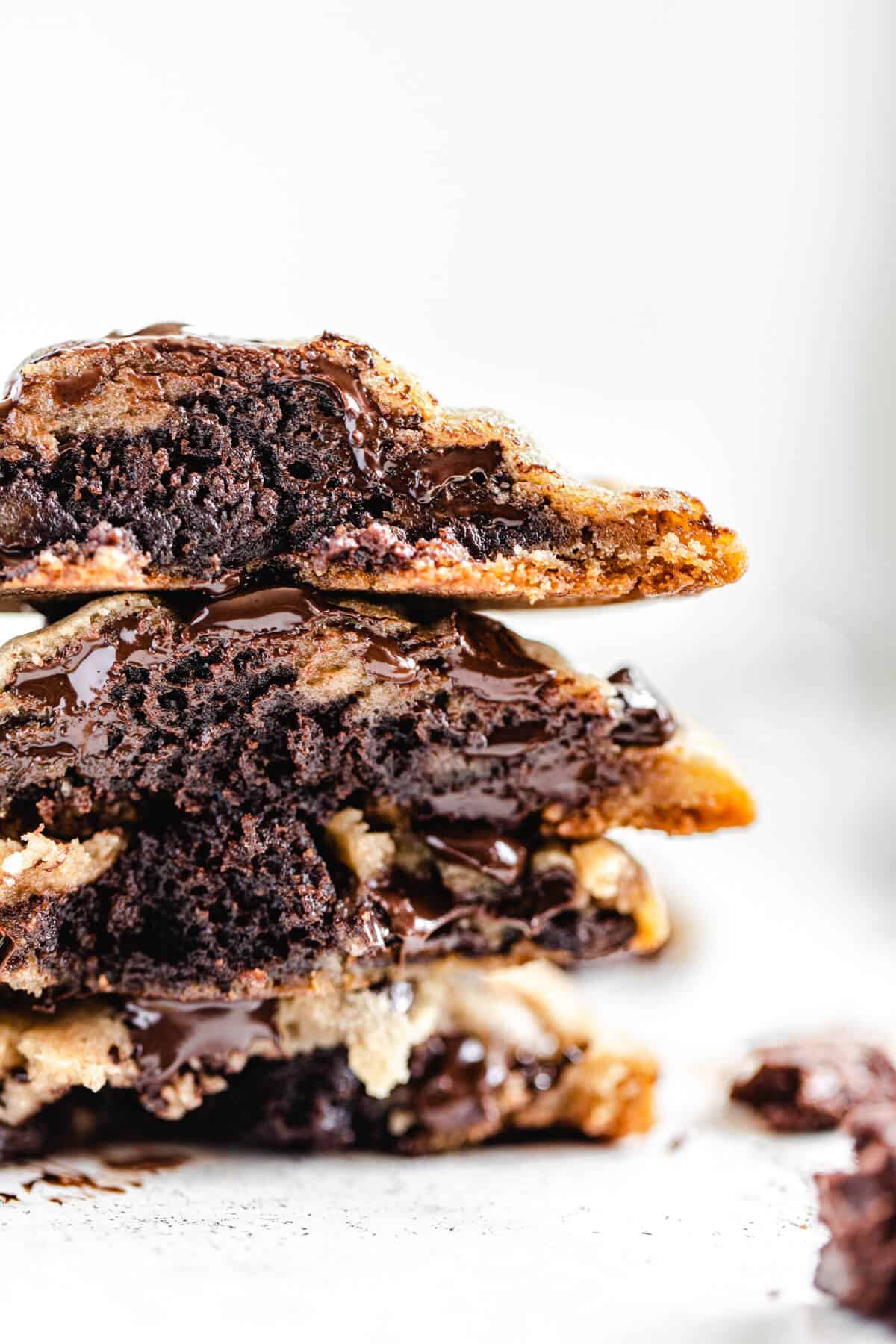 stack of halved brownie stuffed chocolate chip cookies