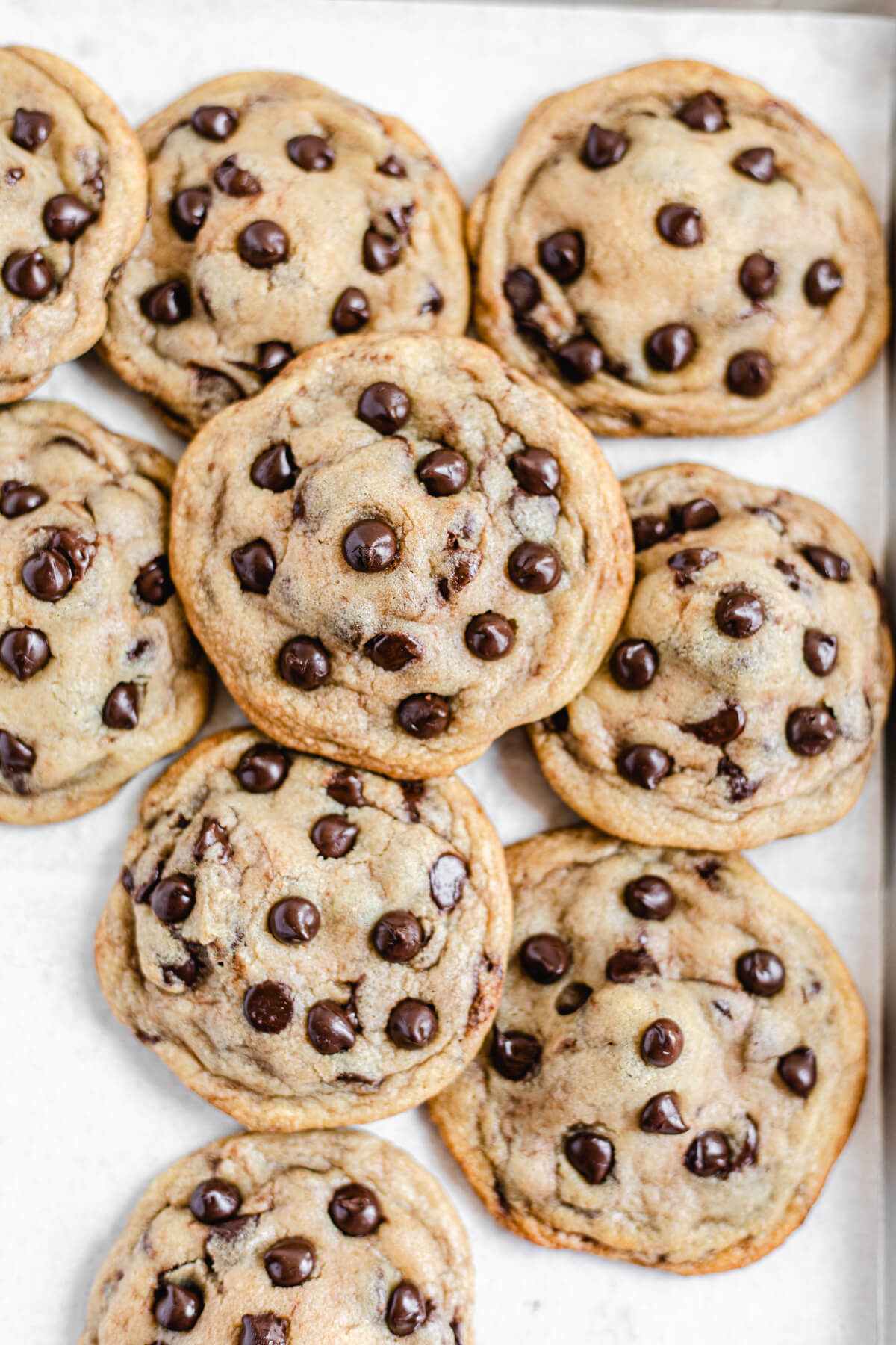 cookies piled together on a baking sheet