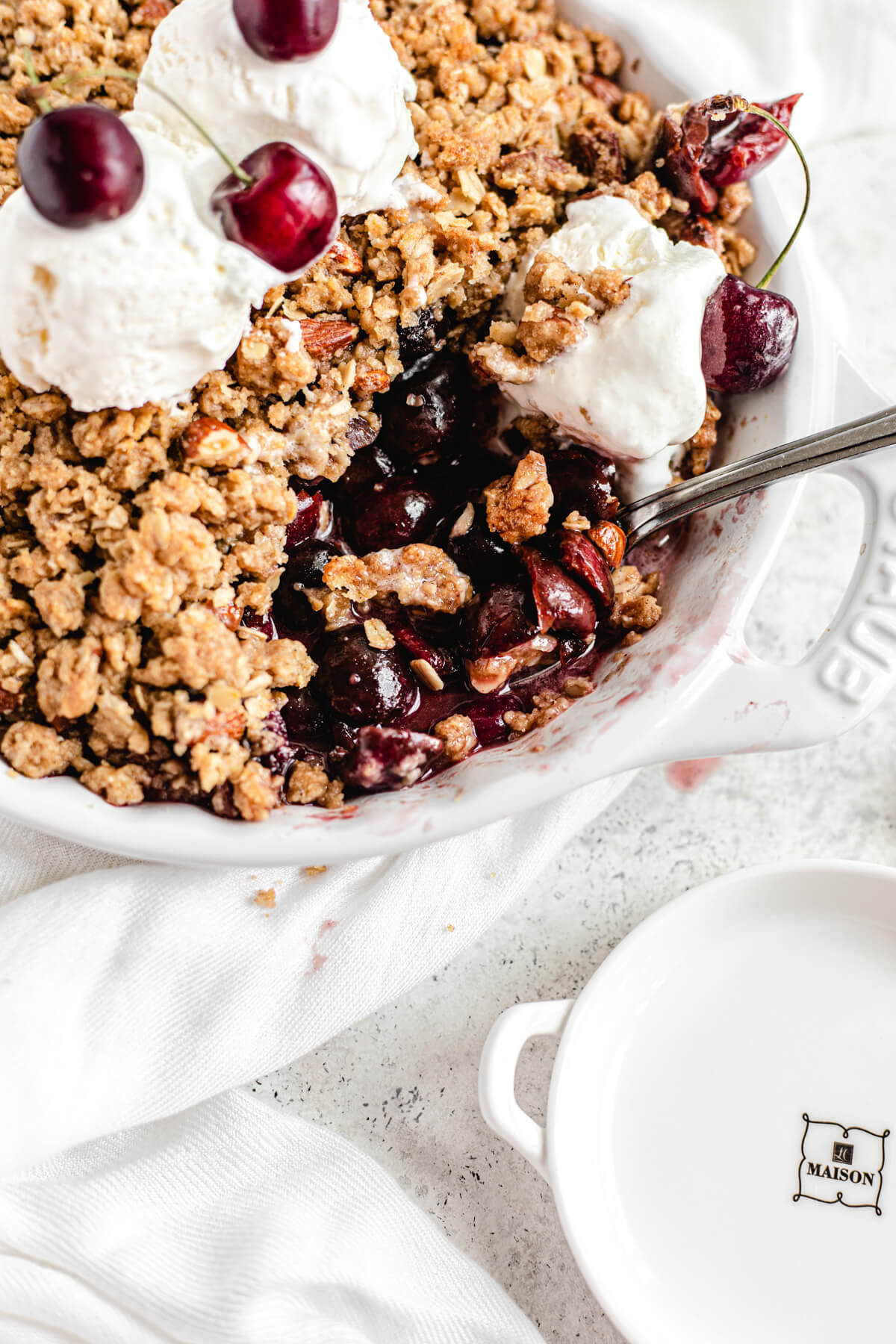 close up of crumble with spoonful taken out to reveal the filling