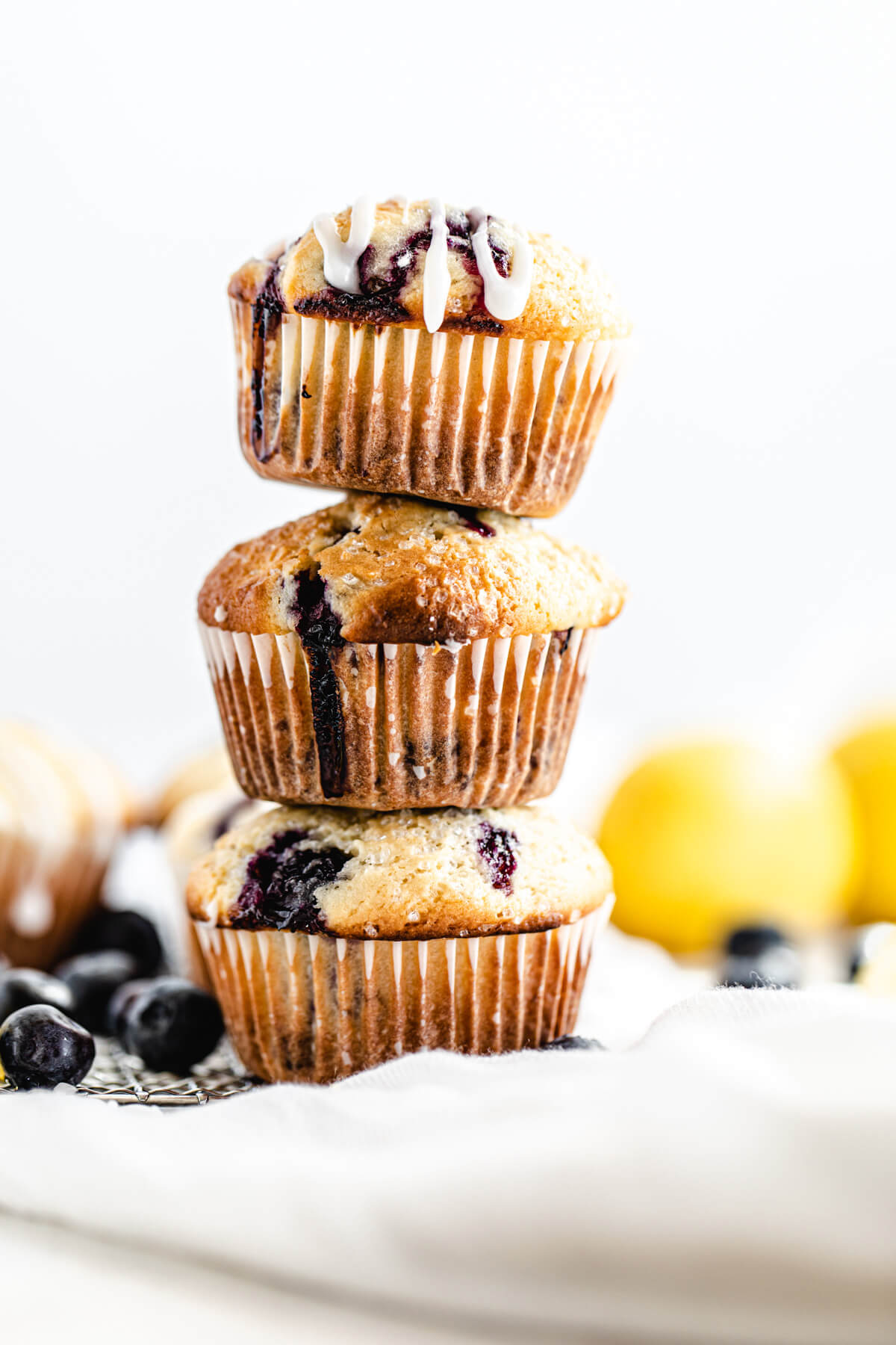 three blueberry muffins stacked on top of each other