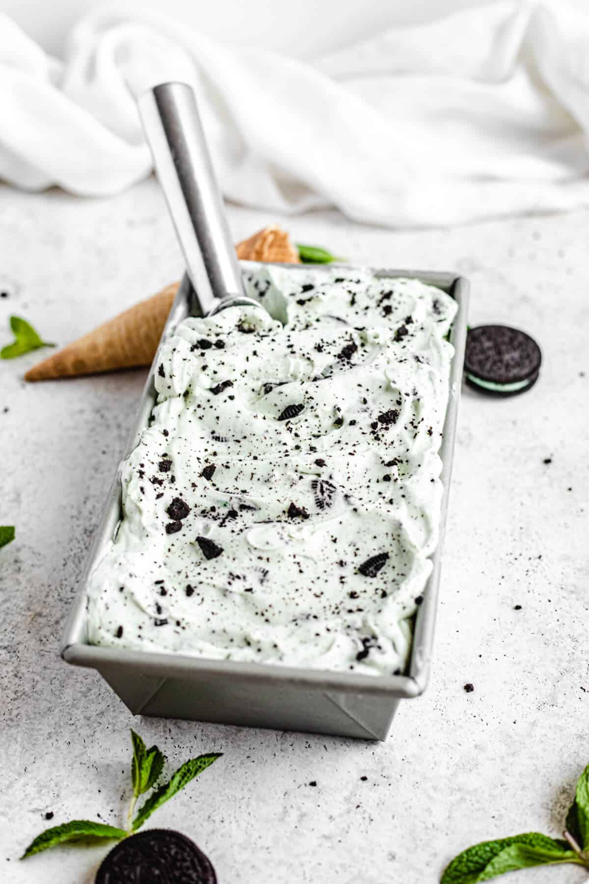 ice cream in a loaf pan with ice cream scoop inside