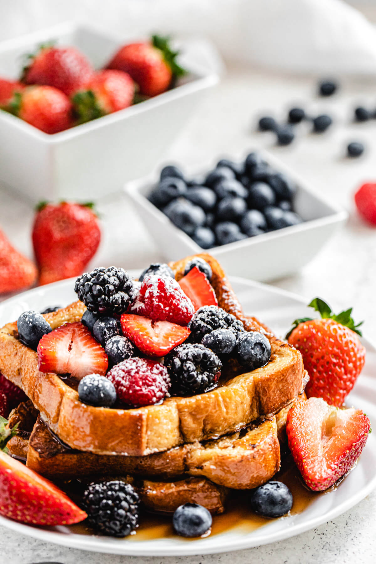 French toast topped with berries and icing sugar