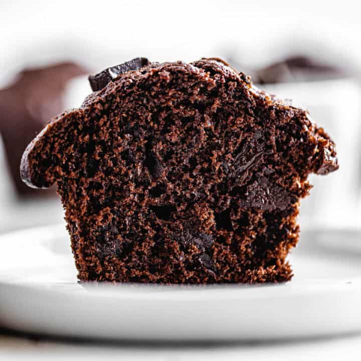 halved muffin on a small white plate