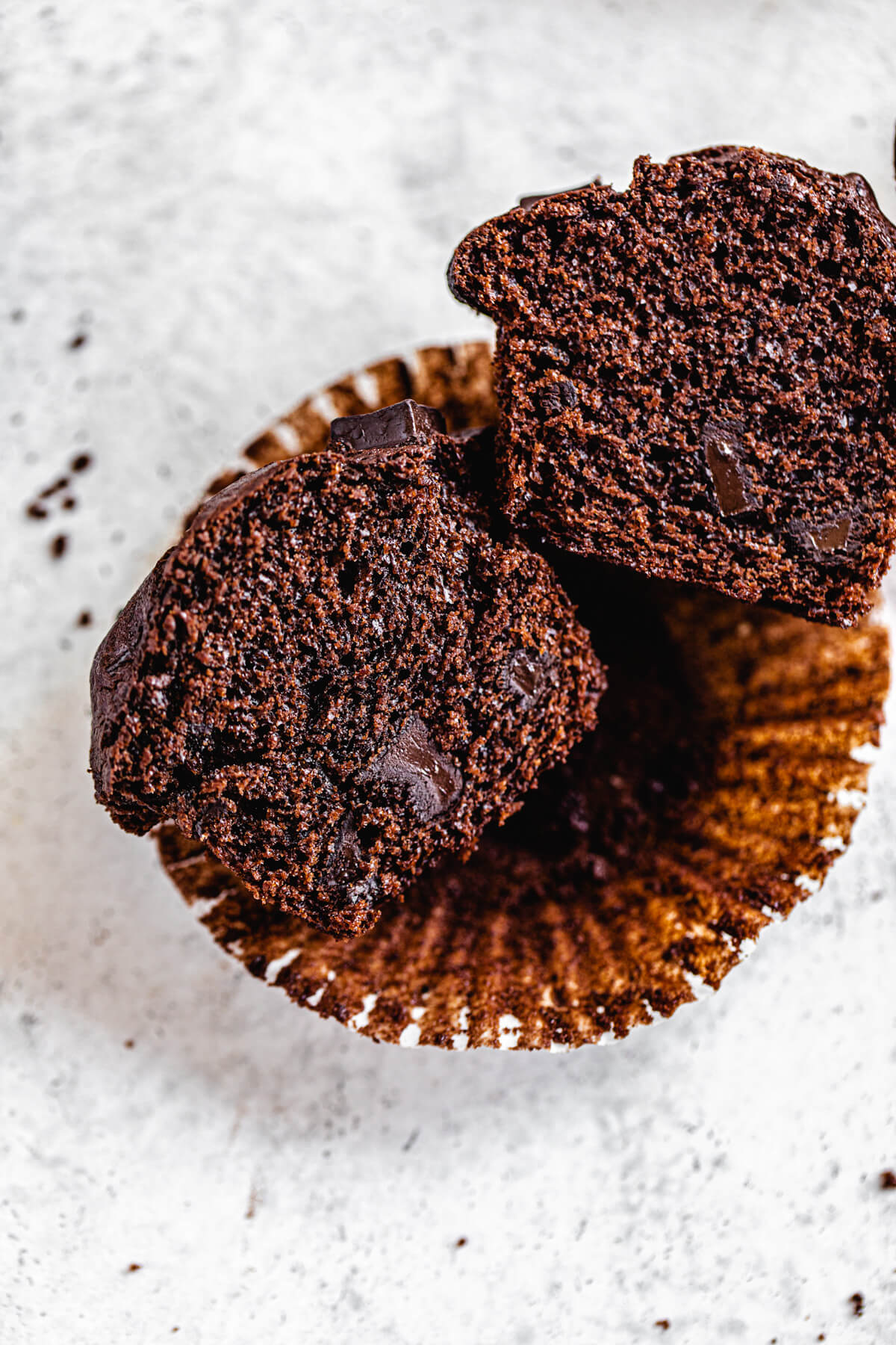 cut open muffins laying on muffin liner