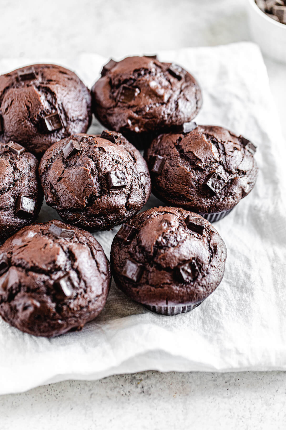 muffins on a plate lined with a white napkin