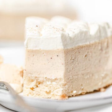 close up of eggnog cheesecake slice on a plate