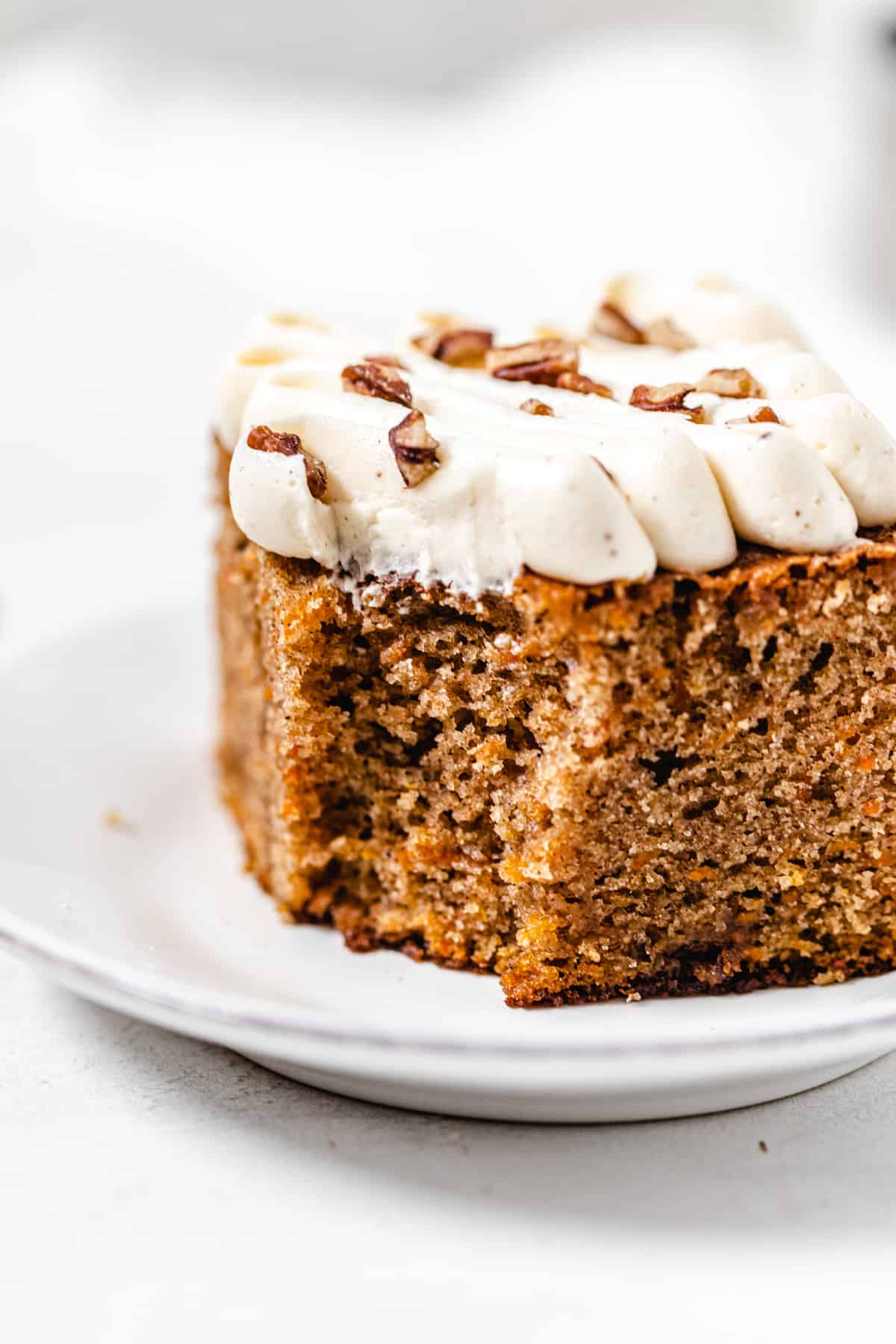 close up of half eaten slice of carrot cake