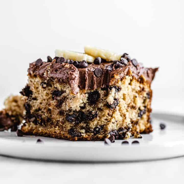 slice of cake on a white plate with bite taken out of it