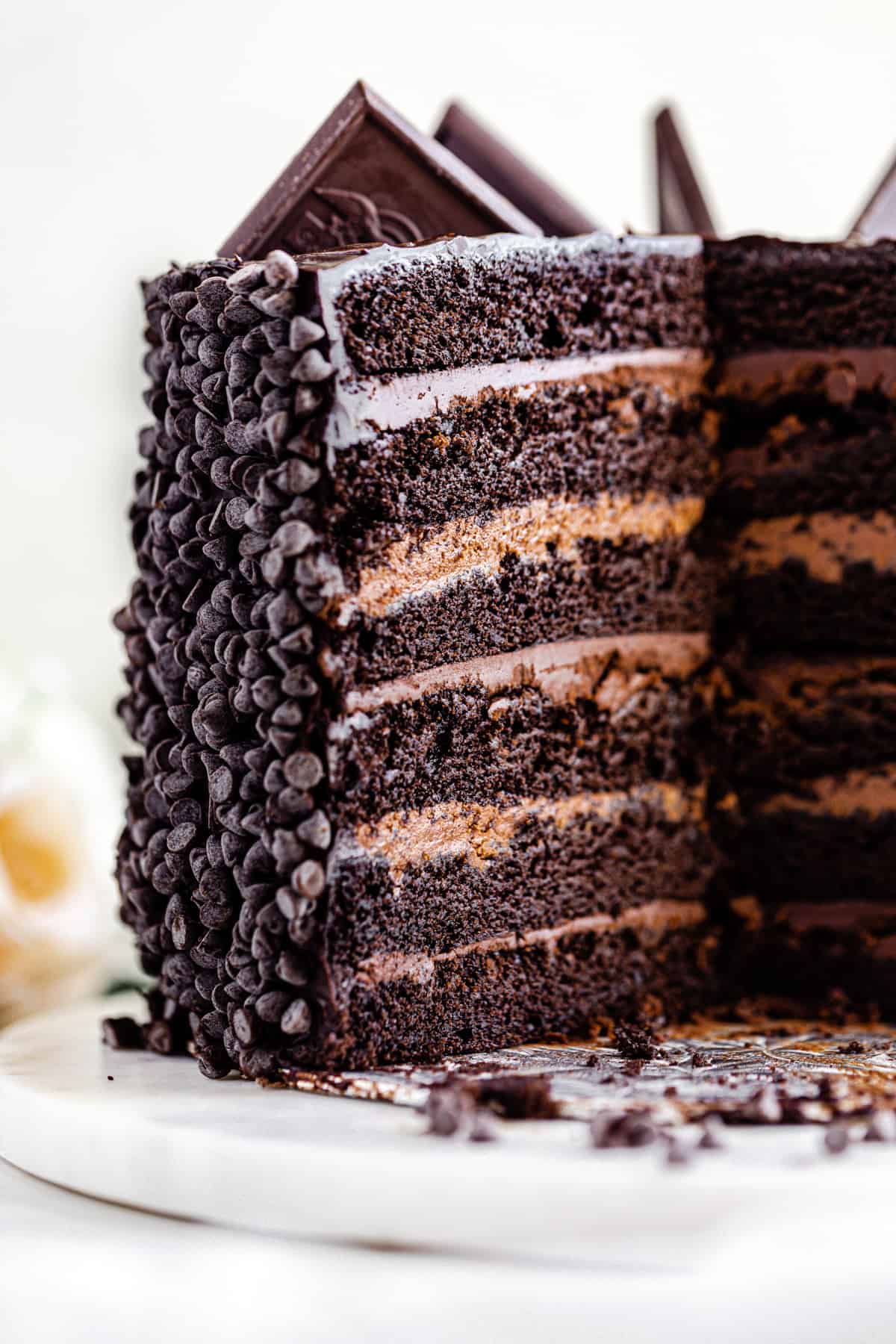 sliced open chocolate cake on a cake board