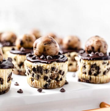 mini cheesecakes on the back of a white tray