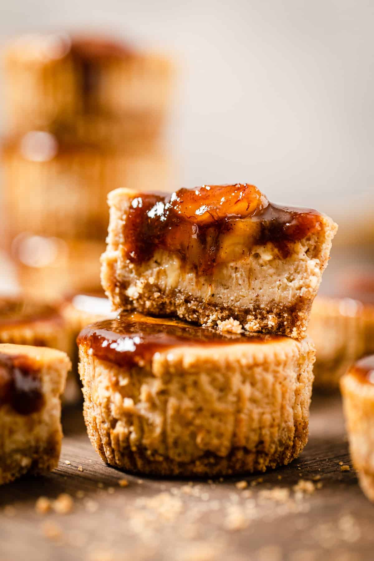 halved mini cheesecake sitting on top of a whole cheesecake