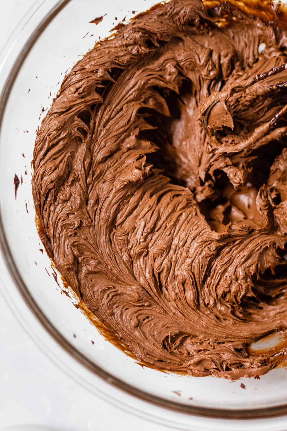 whipped chocolate ganache in a glass bowl