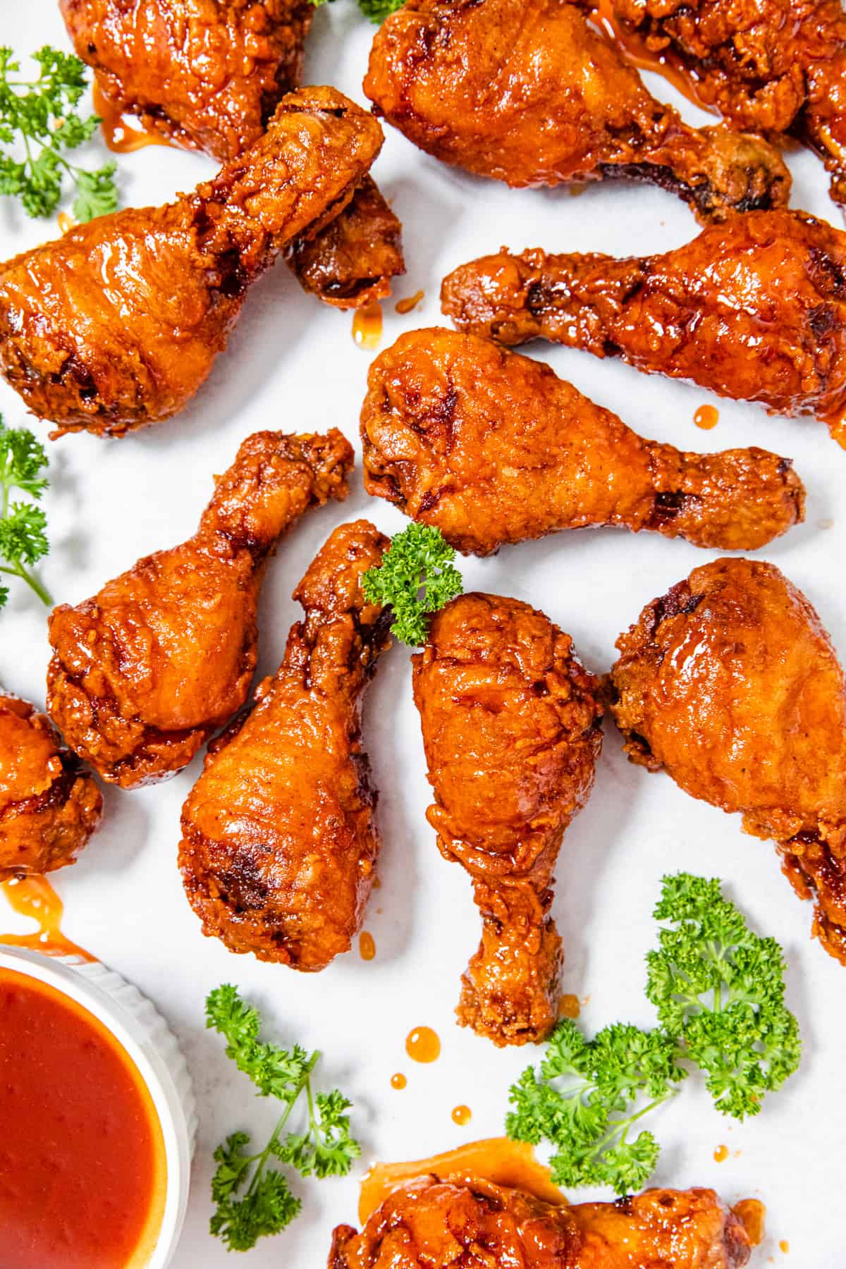 crispy chicken pieces on a parchment lined baking sheet