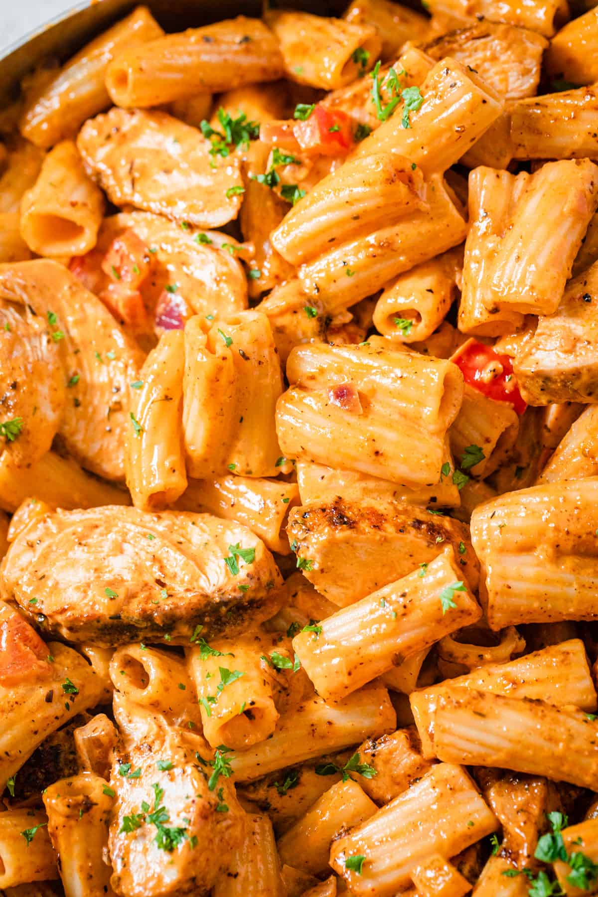 close up of chicken pasta in a pan