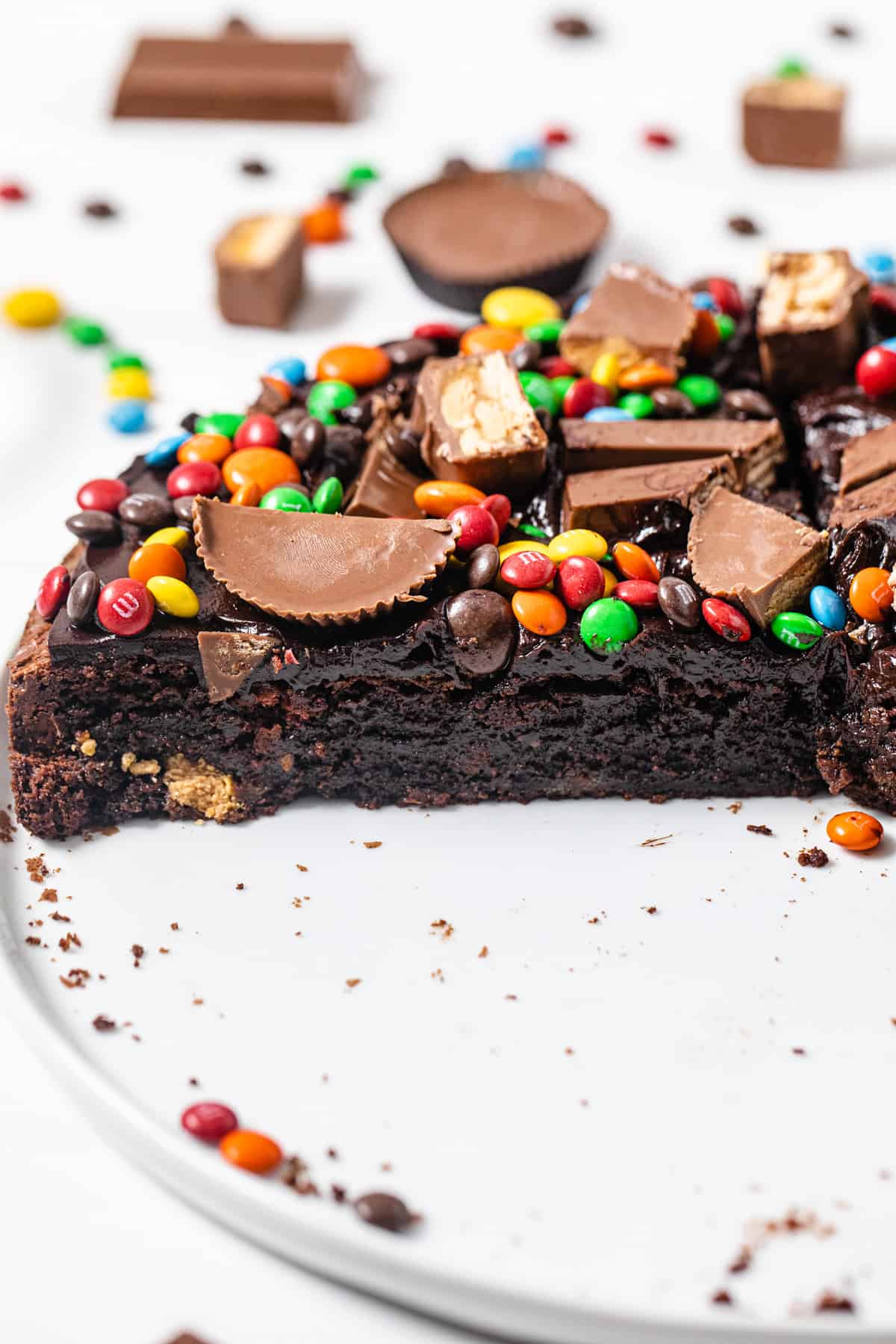 sliced brownie cake on a white platter