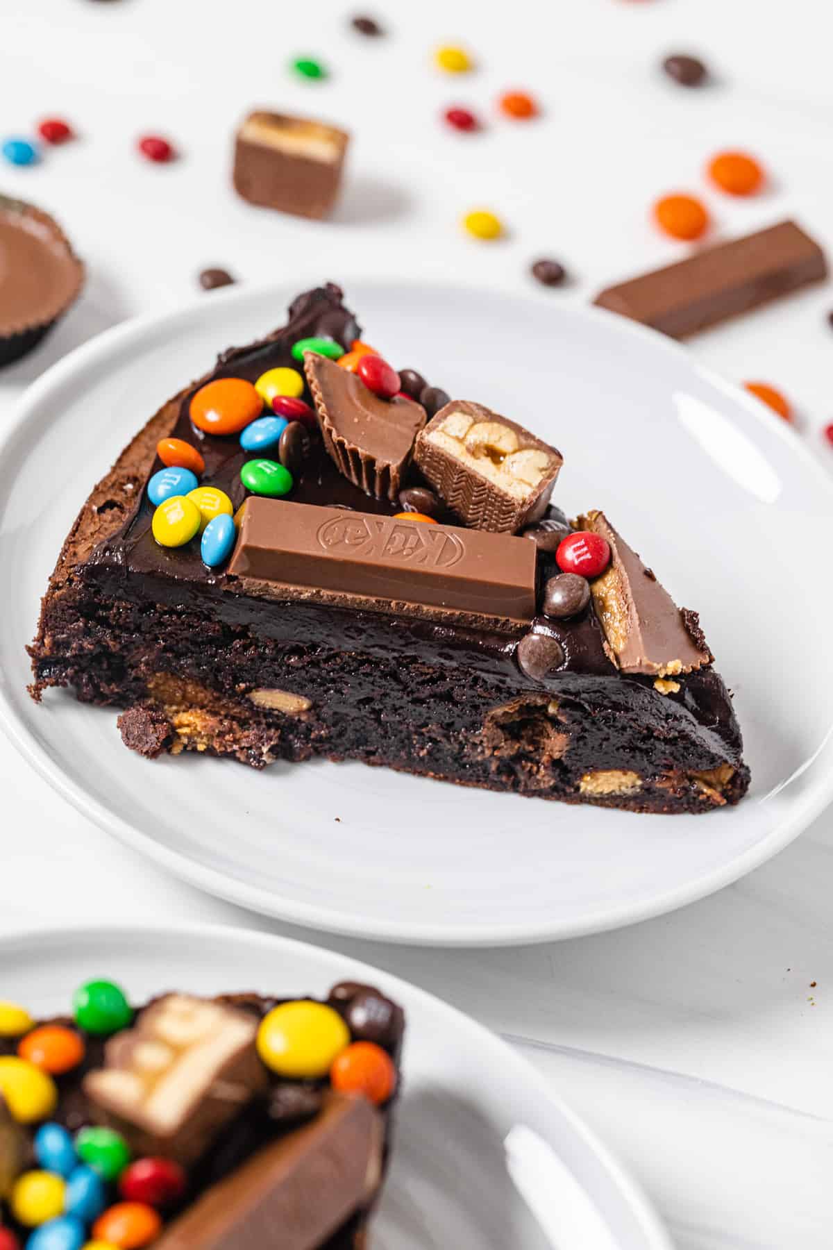 slice of brownie topped with assorted chocolate's