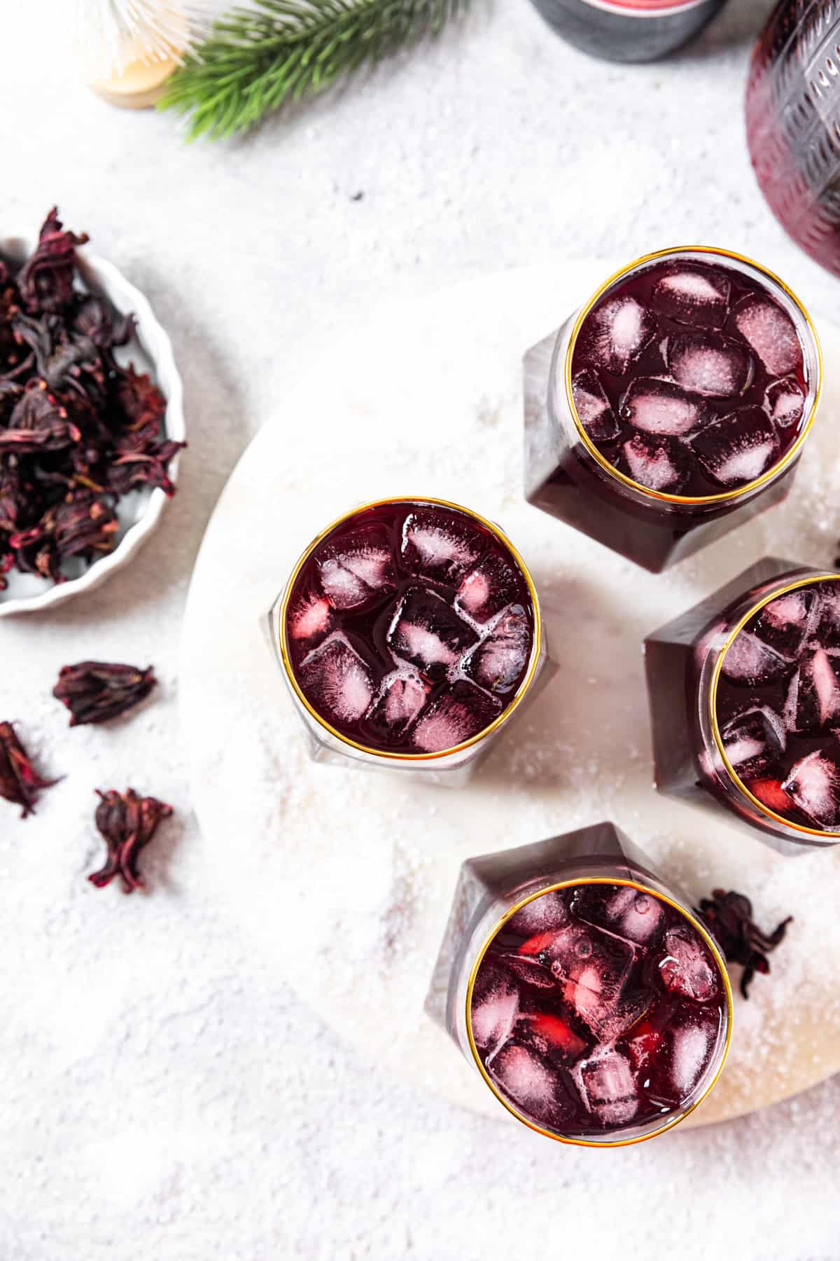 top view of four glasses of sorrel with ice