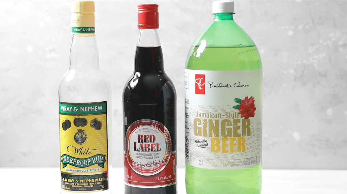 a bottle of white rum, red-label wine and Jamaican ginger beer