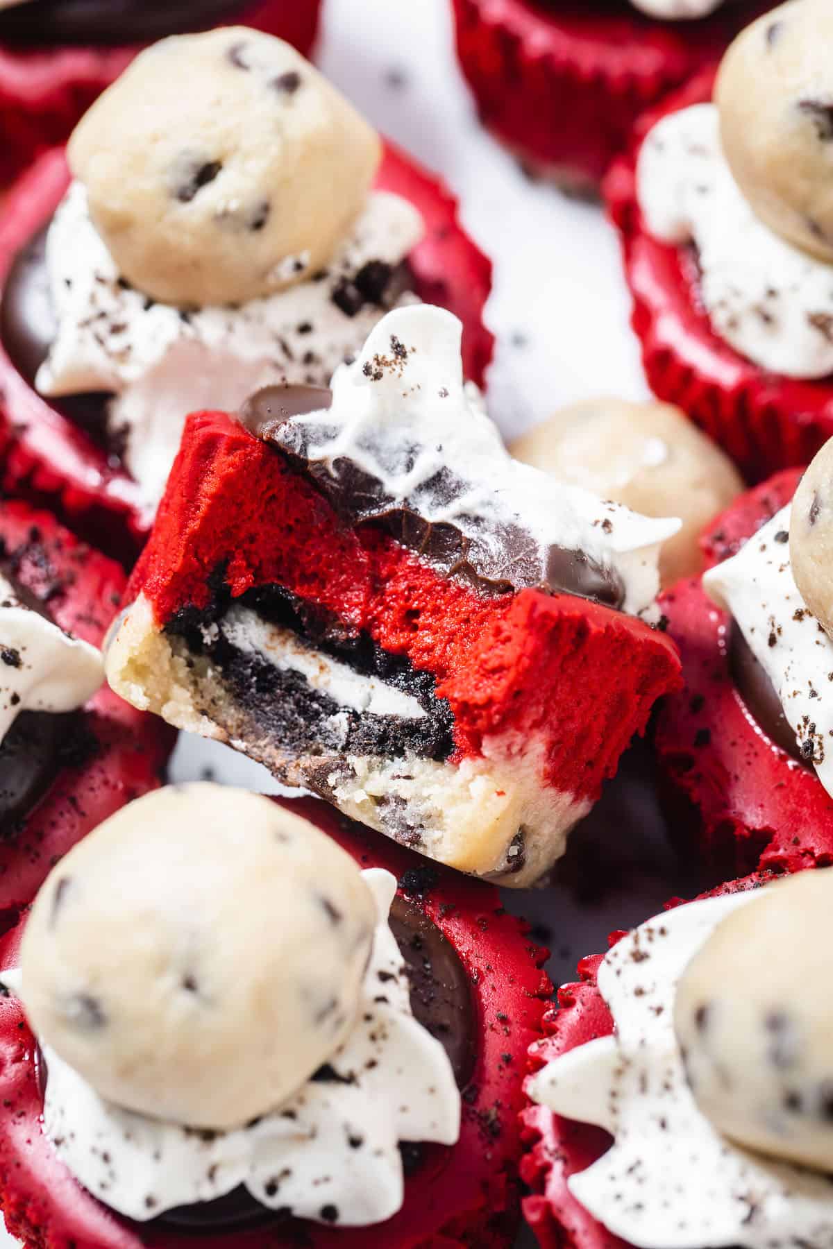 close up of red velvet cheesecake cupcake stuffed with Oreo